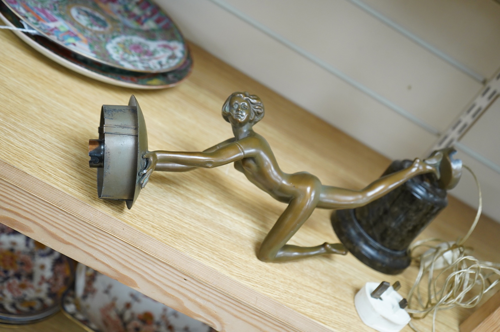 An Art Deco patinated spelter figural lamp, serpentine marble plinth (detached)